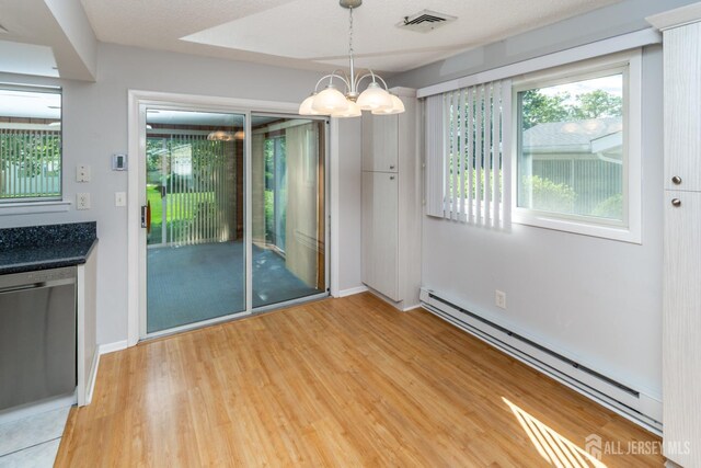 249 Doremus Dr Unit B, Monroe, NJ 08831 - unfurnished dining area with a baseboard radiator, a chandelier, light wood-style floors, and baseboards