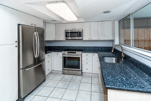 249 Doremus Dr Unit B, Monroe, NJ 08831 - kitchen featuring stainless steel appliances, a sink, light tile patterned flooring, and dark stone counters