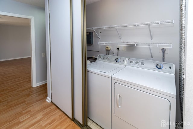 249 Doremus Dr Unit B, Monroe, NJ 08831 - laundry room featuring washer and dryer, light wood finished floors, and baseboards