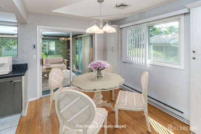 249 Doremus Dr Unit B, Monroe, NJ 08831 - dining space with a chandelier, light wood-style flooring, a baseboard heating unit, and baseboards
