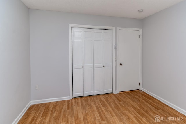 249 Doremus Dr Unit B, Monroe, NJ 08831 - unfurnished bedroom with light wood-style floors, baseboards, and a closet