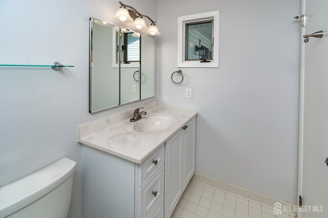 249 Doremus Dr Unit B, Monroe, NJ 08831 - half bath featuring toilet, vanity, tile patterned floors, and baseboards