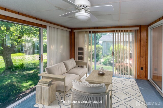249 Doremus Dr Unit B, Monroe, NJ 08831 - sunroom featuring a ceiling fan, carpet, an outdoor hangout area, and wood walls
