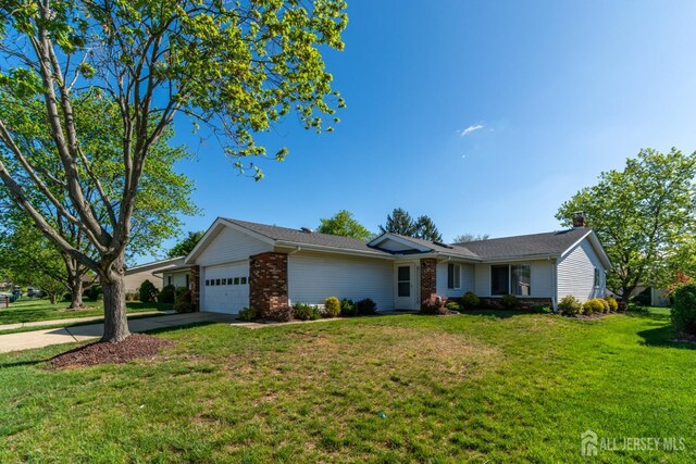 249 Doremus Dr Unit B, Monroe, NJ 08831 - ranch-style home featuring an attached garage, driveway, brick siding, and a front lawn
