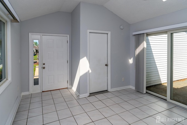 249 Doremus Dr Unit B, Monroe, NJ 08831 - entryway with vaulted ceiling, baseboards, and light tile patterned flooring