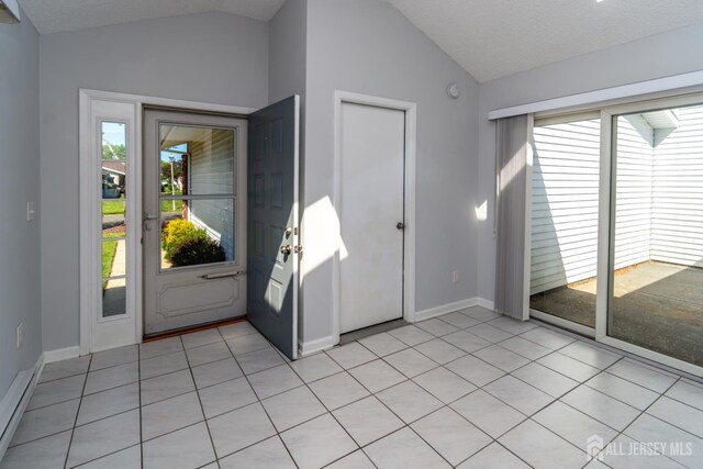 249 Doremus Dr Unit B, Monroe, NJ 08831 - foyer with vaulted ceiling, baseboards, and light tile patterned floors