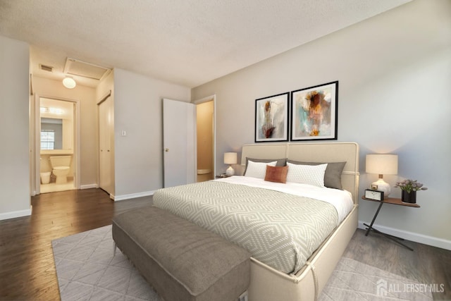 bedroom featuring visible vents, wood finished floors, and baseboards