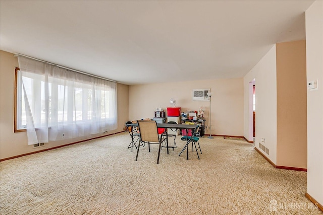50 Lilac St, Edison, NJ 08817 - carpeted dining area with a desk, baseboards, and a wall unit AC
