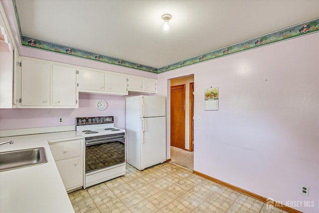 50 Lilac St, Edison, NJ 08817 - kitchen featuring white appliances, light countertops, a sink, white cabinetry, and light flooring