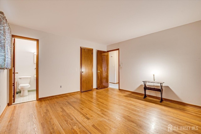 50 Lilac St, Edison, NJ 08817 - unfurnished bedroom featuring light wood-style flooring, baseboards, and ensuite bathroom