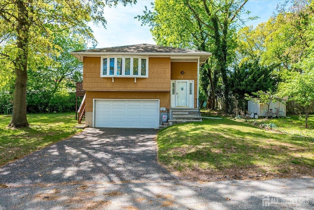 50 Lilac St, Edison, NJ 08817 - view of front of home featuring an attached garage, a front yard, driveway, a storage unit, and an outdoor structure