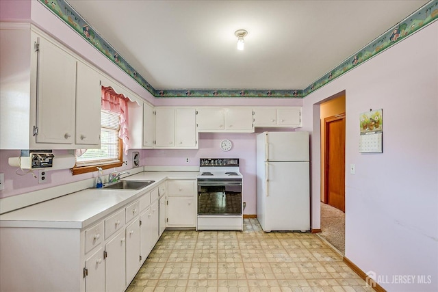 50 Lilac St, Edison, NJ 08817 - kitchen featuring white appliances, a sink, light floors, light countertops, and white cabinetry
