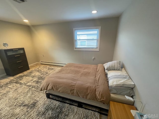 bedroom with a baseboard heating unit