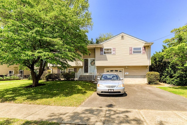 24 Grand Ave, South River, NJ 08882 - raised ranch with asphalt driveway, a front lawn, and an attached garage