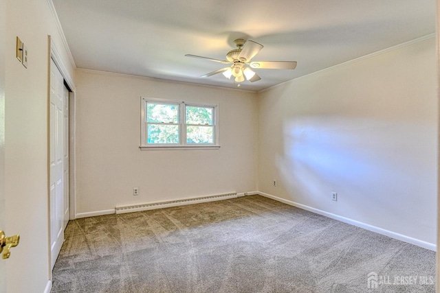 unfurnished bedroom with ornamental molding, baseboards, carpet flooring, and baseboard heating