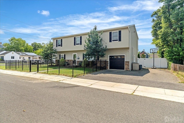 view of front facade featuring a front yard and a garage