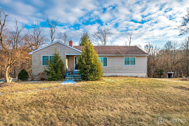 ranch-style home with a front lawn