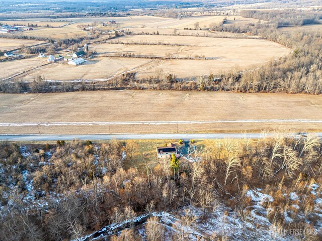 birds eye view of property featuring a rural view