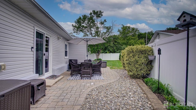 27 Carlton Ave, Monroe, NJ 08831 - fenced backyard featuring a patio and outdoor dining space