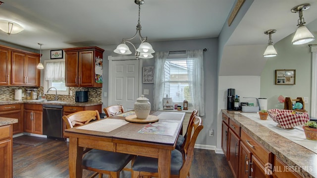27 Carlton Ave, Monroe, NJ 08831 - dining space with dark wood-style flooring, healthy amount of natural light, a chandelier, and baseboards