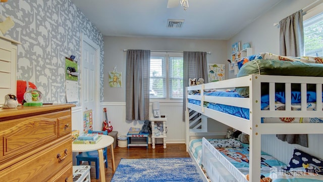 27 Carlton Ave, Monroe, NJ 08831 - bedroom with wood finished floors, a wainscoted wall, and wallpapered walls
