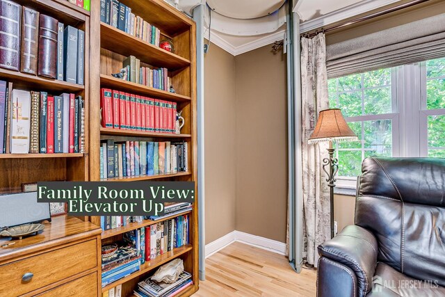 147 Smith St, South Plainfield, NJ 07080 - sitting room featuring baseboards, wood finished floors, and crown molding