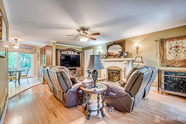 147 Smith St, South Plainfield, NJ 07080 - living room featuring ceiling fan, light wood finished floors, a glass covered fireplace, and crown molding
