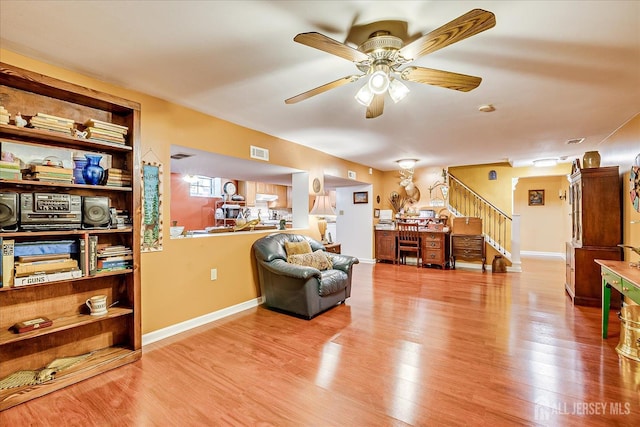 147 Smith St, South Plainfield, NJ 07080 - living room with stairs, wood finished floors, ceiling fan, and baseboards