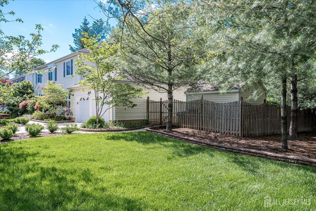 147 Smith St, South Plainfield, NJ 07080 - view of yard featuring an attached garage