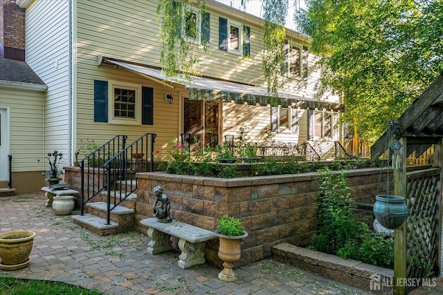 147 Smith St, South Plainfield, NJ 07080 - rear view of house featuring a patio area