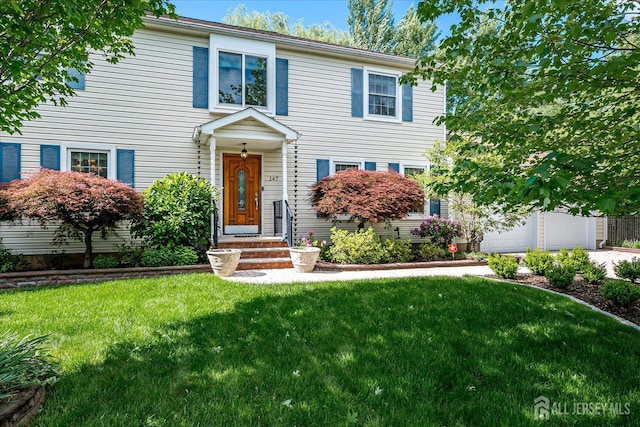 147 Smith St, South Plainfield, NJ 07080 - traditional-style home featuring a garage and a front yard