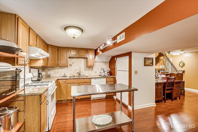 147 Smith St, South Plainfield, NJ 07080 - kitchen with white appliances, under cabinet range hood, light wood-style floors, and a sink