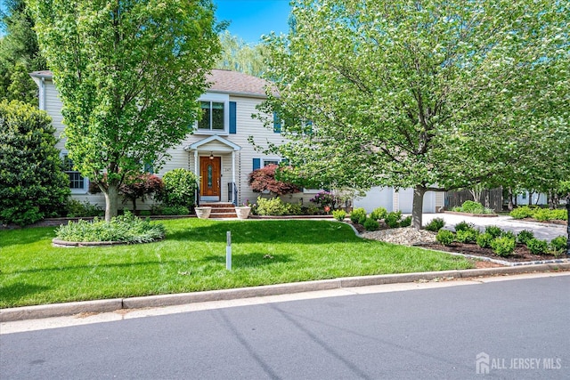 147 Smith St, South Plainfield, NJ 07080 - obstructed view of property with a front yard, a garage, and driveway