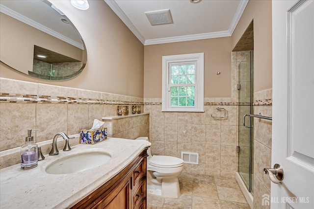 147 Smith St, South Plainfield, NJ 07080 - bathroom featuring tile walls, a stall shower, vanity, toilet, and ornamental molding