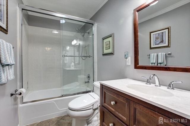 bathroom with crown molding, bath / shower combo with glass door, toilet, tile patterned floors, and vanity