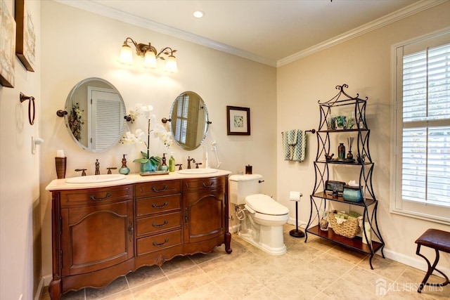 full bathroom with crown molding, toilet, baseboards, and a sink