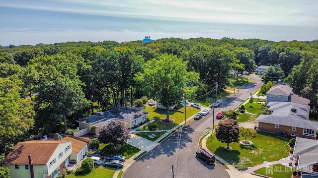 drone / aerial view featuring a view of trees