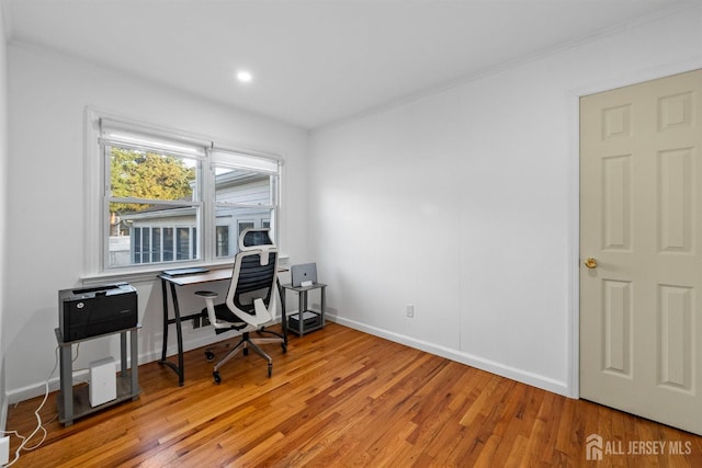 office area featuring crown molding, recessed lighting, baseboards, and wood finished floors