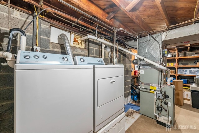 laundry area featuring washing machine and clothes dryer and laundry area