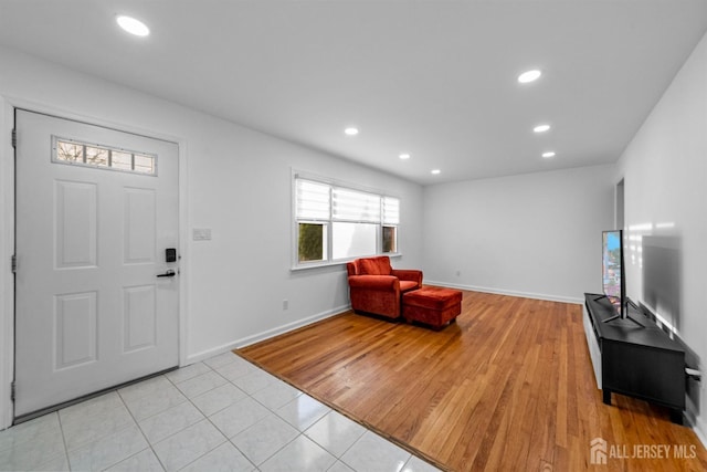 entrance foyer with baseboards, recessed lighting, and light tile patterned flooring
