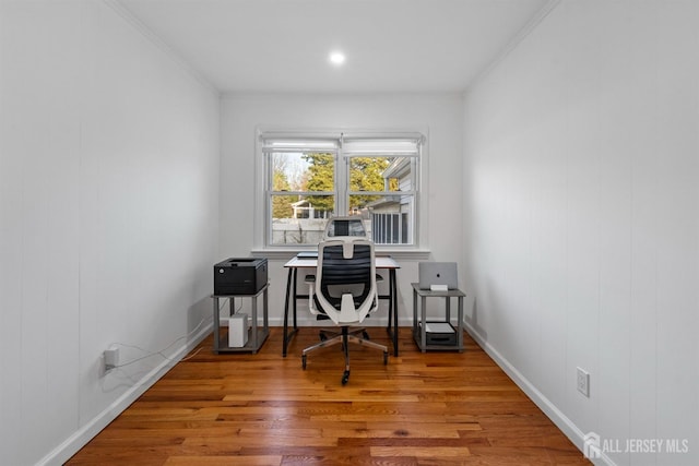 office featuring crown molding, baseboards, and wood finished floors