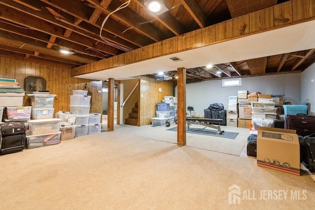 2338 Oxford Ave, South Plainfield, NJ 07080 - below grade area with wood walls, stairway, and carpet