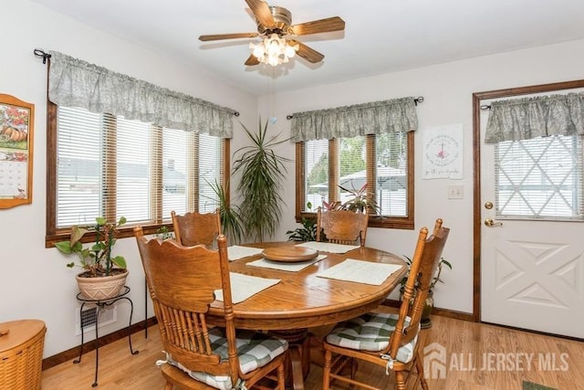 2338 Oxford Ave, South Plainfield, NJ 07080 - dining area with light wood-style floors, ceiling fan, and healthy amount of natural light