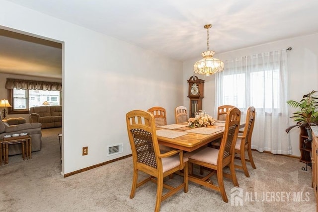 2338 Oxford Ave, South Plainfield, NJ 07080 - dining room featuring light carpet and a chandelier