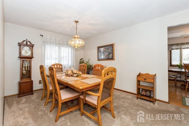 2338 Oxford Ave, South Plainfield, NJ 07080 - dining area with a chandelier and light colored carpet