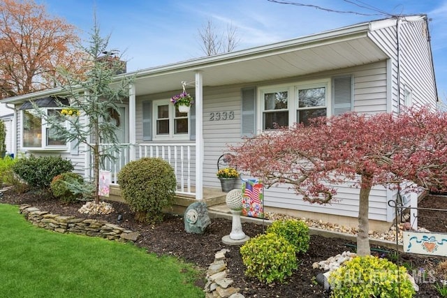 2338 Oxford Ave, South Plainfield, NJ 07080 - view of front of property with covered porch and a chimney