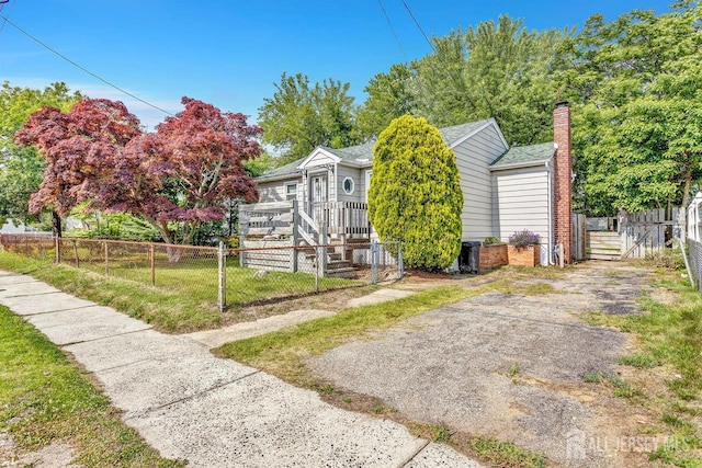 230 Creek Rd, Keansburg, NJ 07734 - view of front of house with a chimney, a deck, and a gate