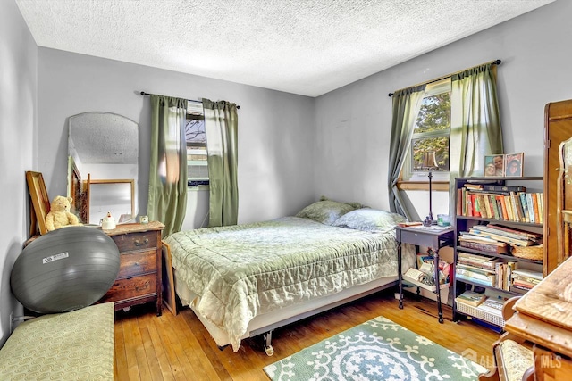 230 Creek Rd, Keansburg, NJ 07734 - bedroom featuring a textured ceiling and wood-type flooring