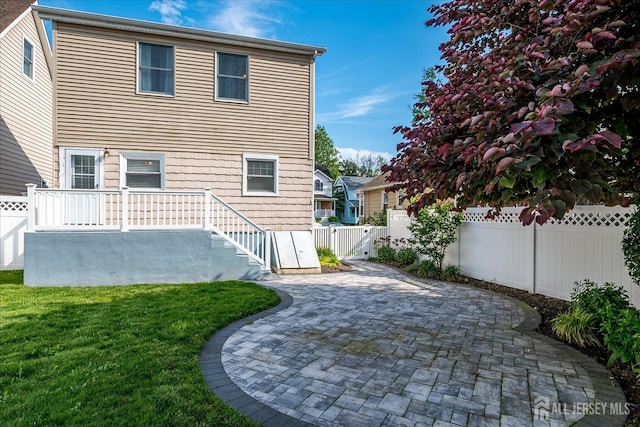 205 Midland Ave, Metuchen, NJ 08840 - rear view of property with a patio area and a fenced backyard