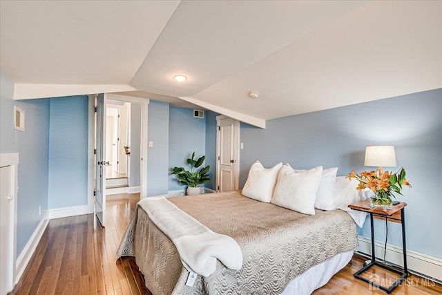 205 Midland Ave, Metuchen, NJ 08840 - bedroom with baseboard heating, hardwood / wood-style floors, and lofted ceiling